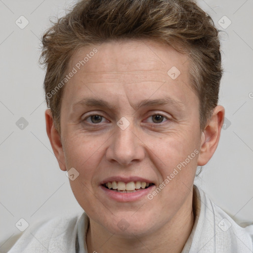 Joyful white adult male with short  brown hair and grey eyes