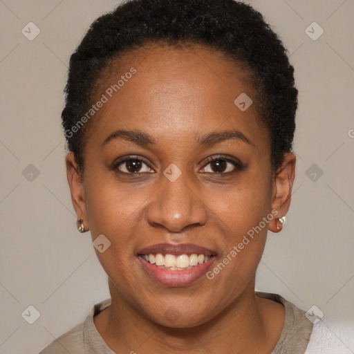 Joyful black young-adult female with short  brown hair and brown eyes