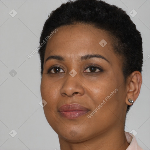 Joyful black young-adult female with short  black hair and brown eyes