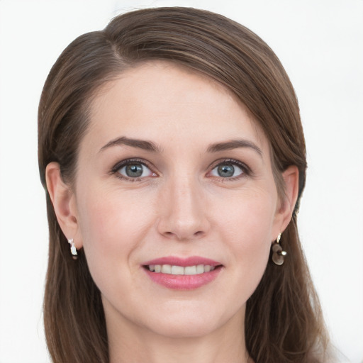 Joyful white young-adult female with long  brown hair and grey eyes