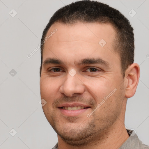 Joyful white young-adult male with short  brown hair and brown eyes