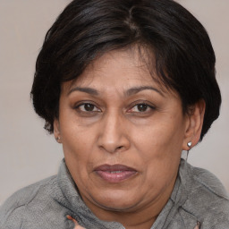 Joyful white adult female with short  brown hair and brown eyes