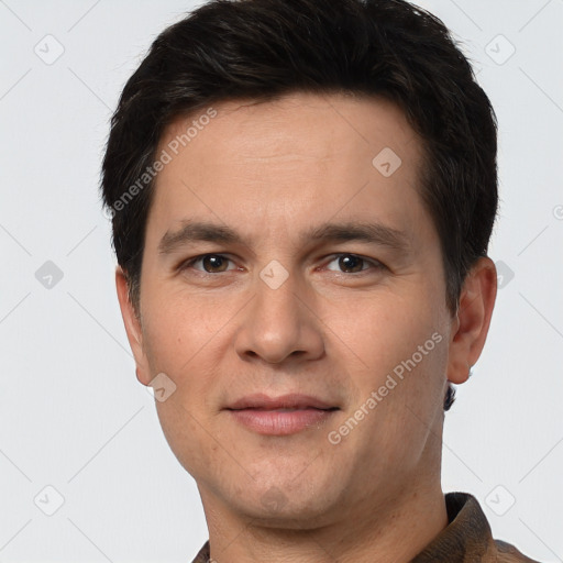 Joyful white young-adult male with short  brown hair and brown eyes