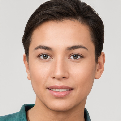 Joyful white young-adult female with short  brown hair and brown eyes