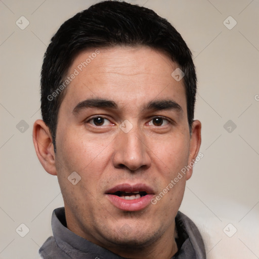 Joyful white adult male with short  black hair and brown eyes