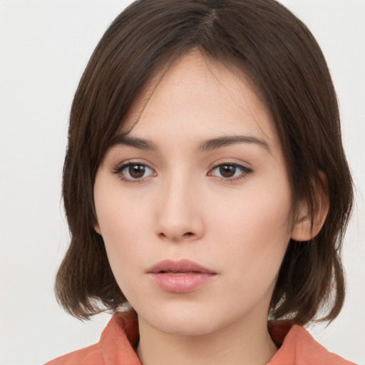 Neutral white young-adult female with medium  brown hair and brown eyes