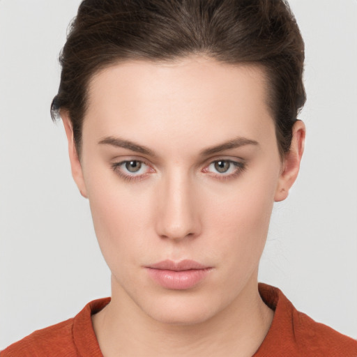 Neutral white young-adult female with short  brown hair and brown eyes