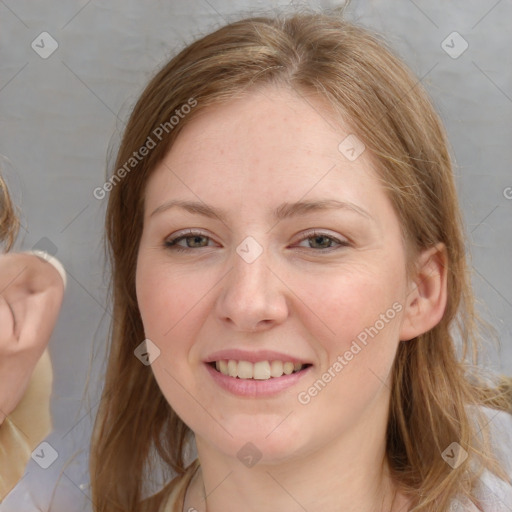 Joyful white young-adult female with medium  brown hair and blue eyes