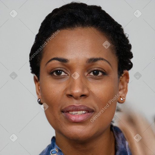 Joyful black young-adult female with short  black hair and brown eyes