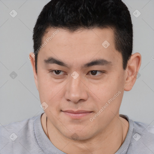 Joyful white young-adult male with short  black hair and brown eyes