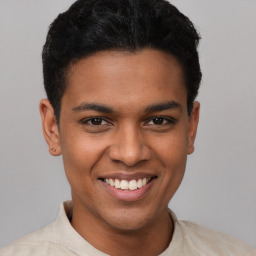 Joyful latino young-adult male with short  black hair and brown eyes