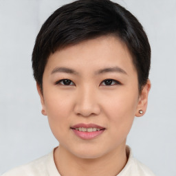 Joyful asian young-adult female with short  brown hair and brown eyes