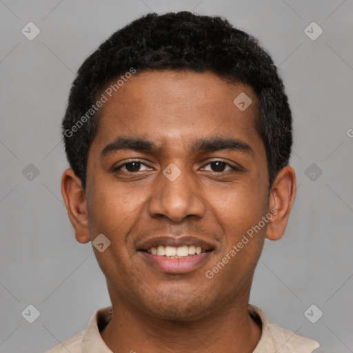 Joyful black young-adult male with short  black hair and brown eyes