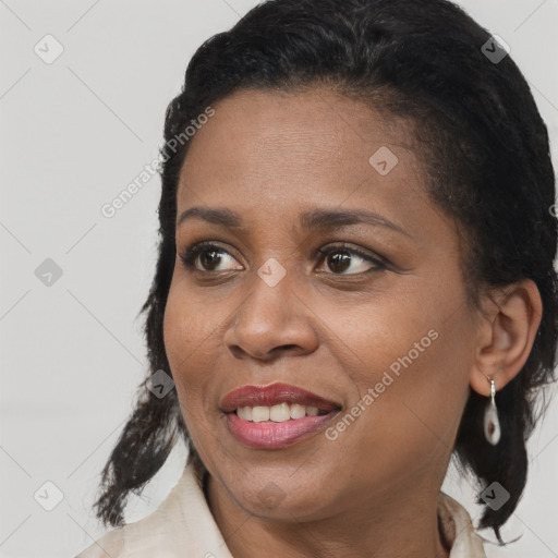 Joyful black young-adult female with medium  brown hair and brown eyes