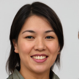 Joyful white young-adult female with medium  brown hair and brown eyes