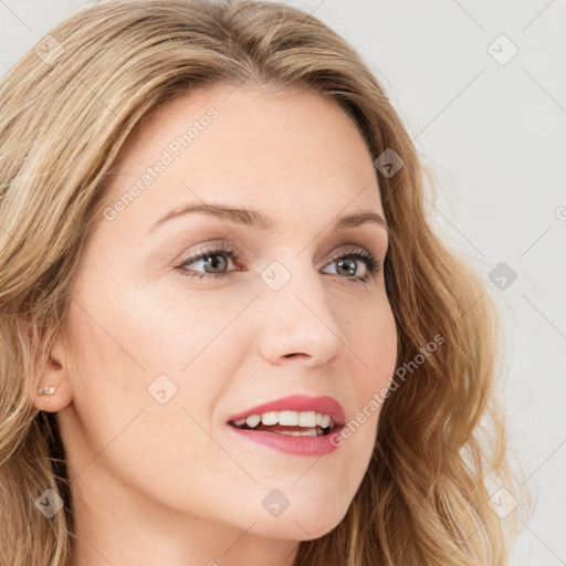 Joyful white young-adult female with long  brown hair and green eyes