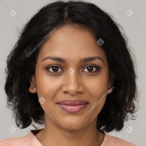 Joyful black young-adult female with medium  brown hair and brown eyes