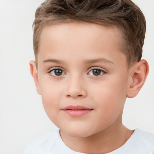 Joyful white child male with short  brown hair and brown eyes