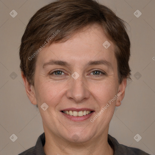 Joyful white adult female with short  brown hair and brown eyes