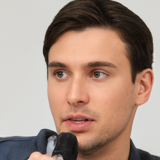 Neutral white young-adult male with short  brown hair and brown eyes