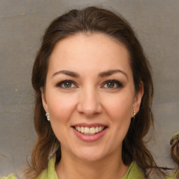 Joyful white young-adult female with medium  brown hair and brown eyes