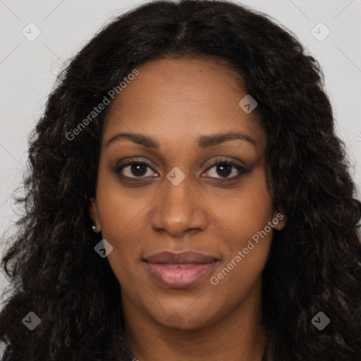 Joyful black young-adult female with long  black hair and brown eyes