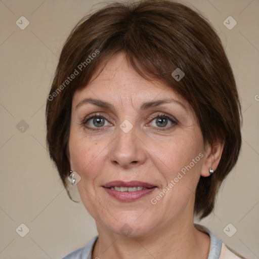 Joyful white adult female with medium  brown hair and grey eyes