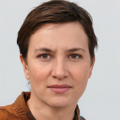 Joyful white adult female with short  brown hair and brown eyes