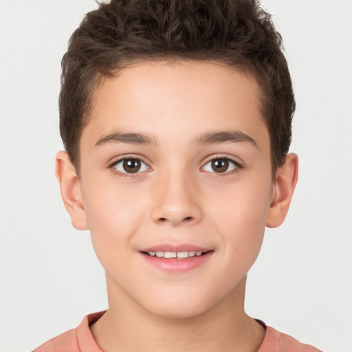 Joyful white child male with short  brown hair and brown eyes