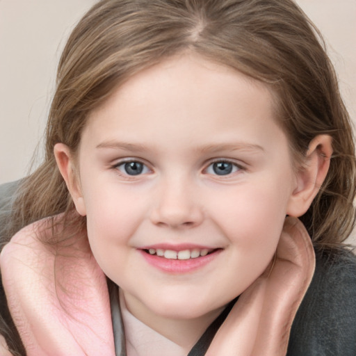 Joyful white child female with medium  brown hair and grey eyes