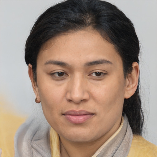 Joyful asian adult female with short  brown hair and brown eyes