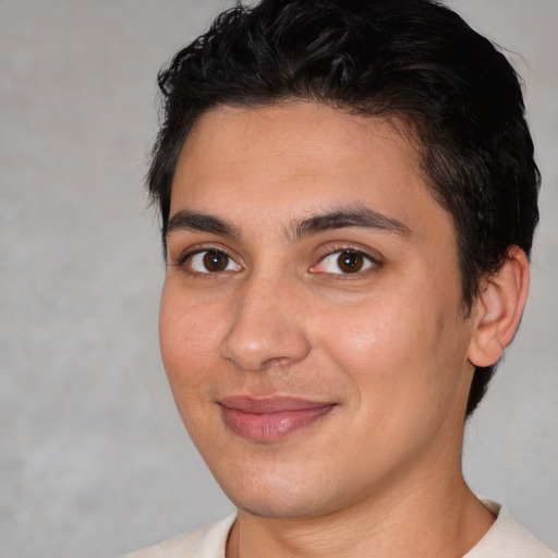 Joyful white young-adult male with short  brown hair and brown eyes