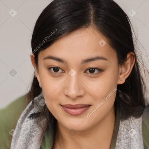 Joyful latino young-adult female with medium  brown hair and brown eyes