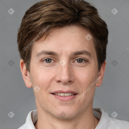 Joyful white adult male with short  brown hair and grey eyes