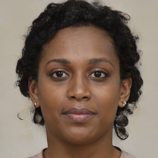 Neutral black young-adult female with medium  brown hair and brown eyes