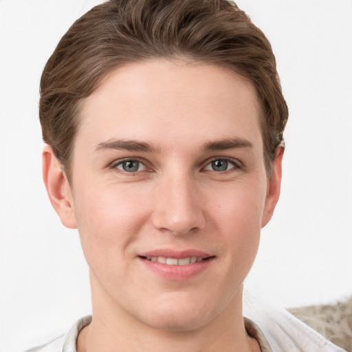 Joyful white young-adult female with short  brown hair and grey eyes