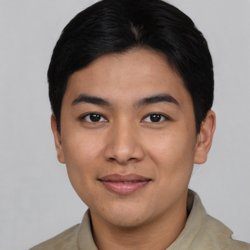Joyful asian young-adult male with short  black hair and brown eyes