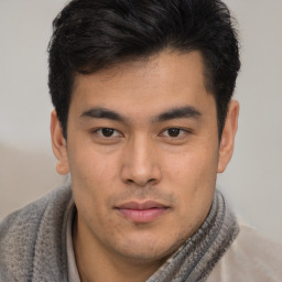 Neutral asian young-adult male with short  brown hair and brown eyes