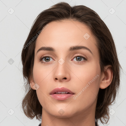 Neutral white young-adult female with medium  brown hair and brown eyes