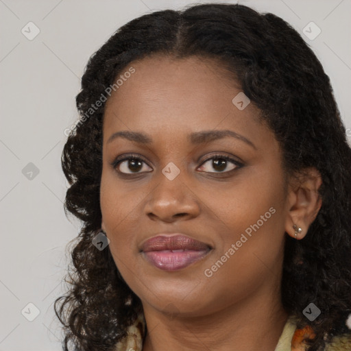 Joyful black young-adult female with long  brown hair and brown eyes