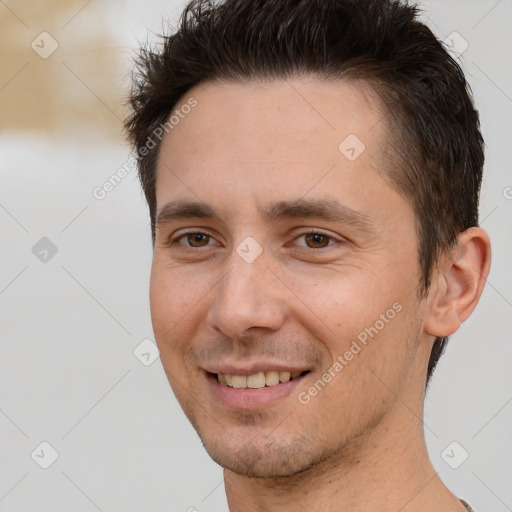 Joyful white young-adult male with short  brown hair and brown eyes