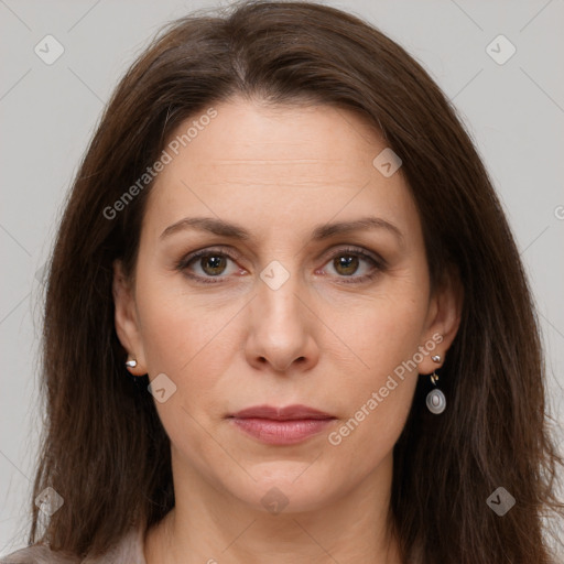 Joyful white adult female with long  brown hair and brown eyes