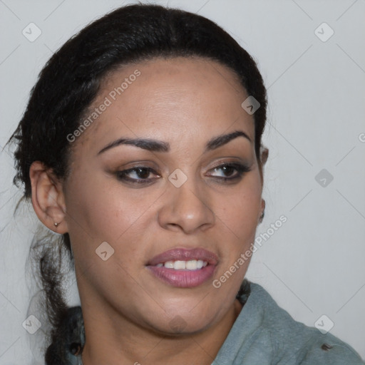 Joyful black young-adult female with long  brown hair and brown eyes