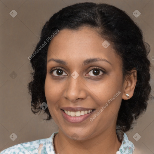 Joyful black young-adult female with medium  brown hair and brown eyes