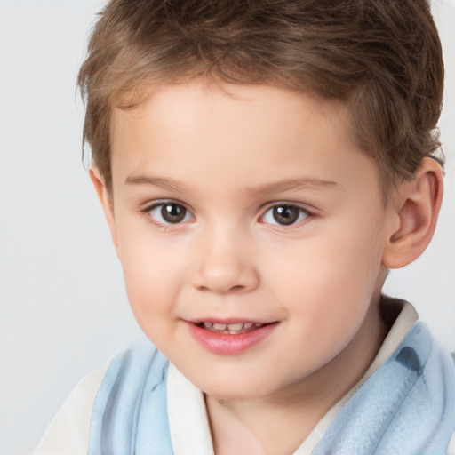 Joyful white child male with short  brown hair and brown eyes