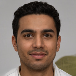 Neutral white young-adult male with short  black hair and brown eyes