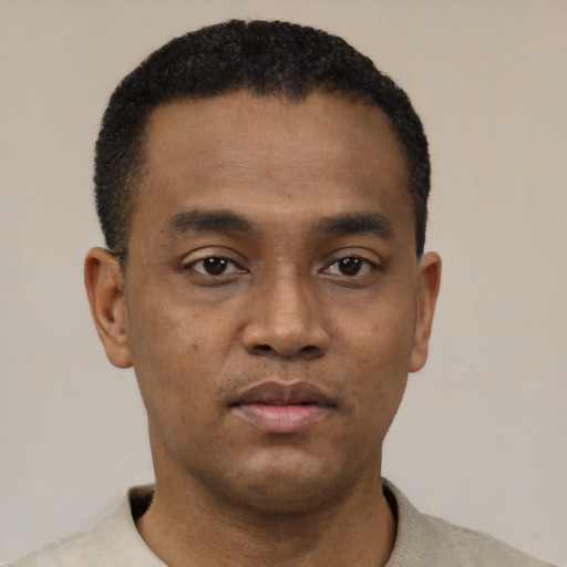 Neutral black young-adult male with short  black hair and brown eyes