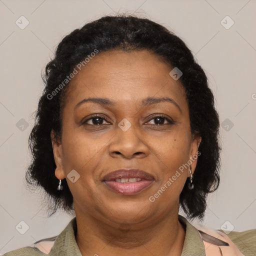 Joyful latino adult female with medium  brown hair and brown eyes