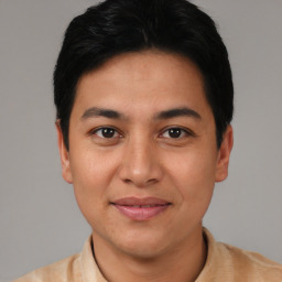 Joyful asian young-adult male with short  black hair and brown eyes