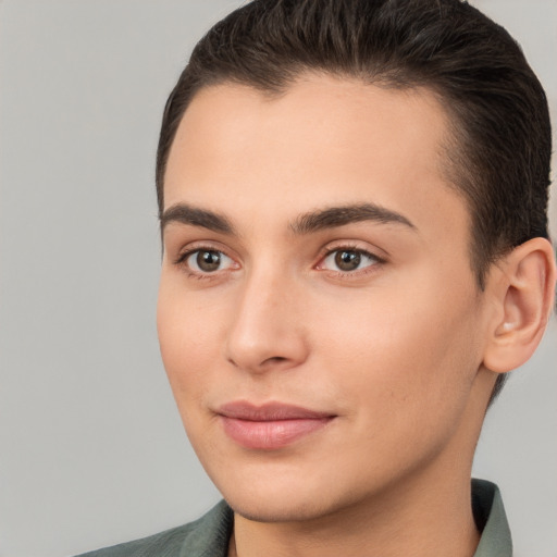 Joyful white young-adult female with short  brown hair and brown eyes